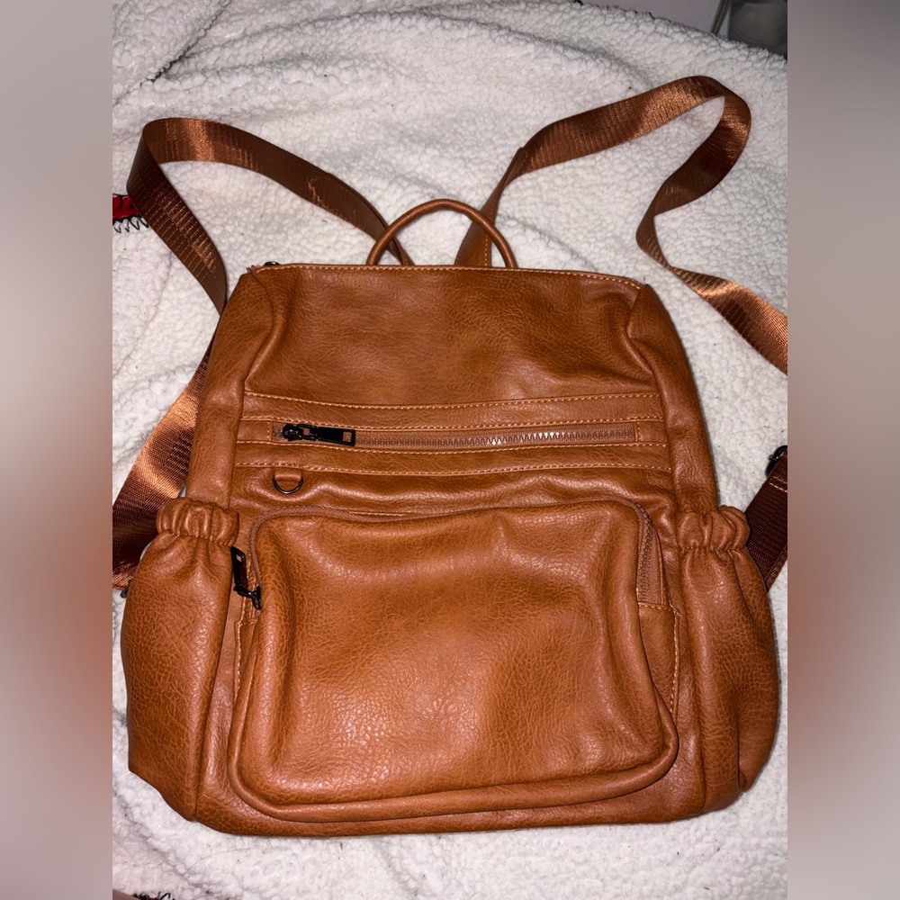 Brown backpack! Don’t use as often
